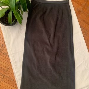 Faux green suede skirt with back slit.